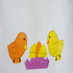 Colored paper cut into chicken and egg