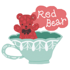 A red bear with a pattern of roses