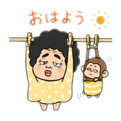 A woman with an afro and a baby monkey