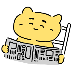 Reading newspaper cat